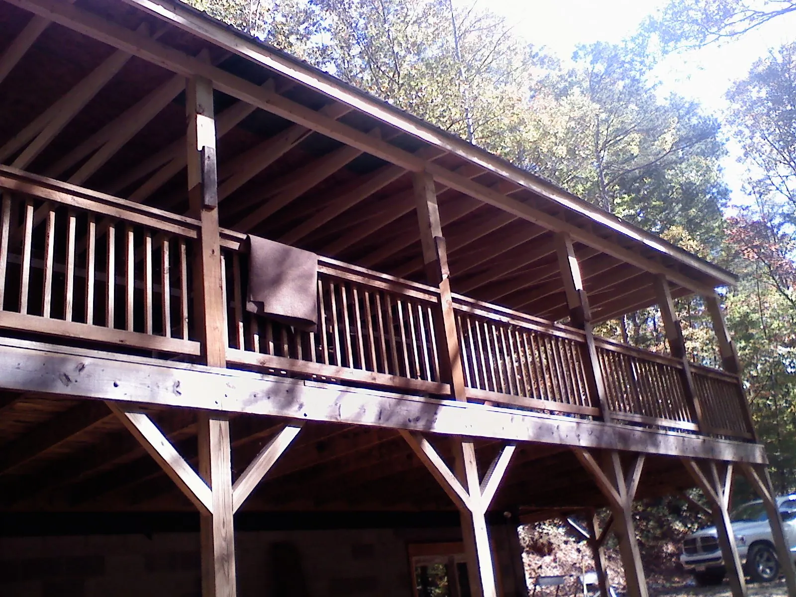 Timber framing under a new elevated porch and deck — Roof Leak Repair in Holliston by Roofing Brothers